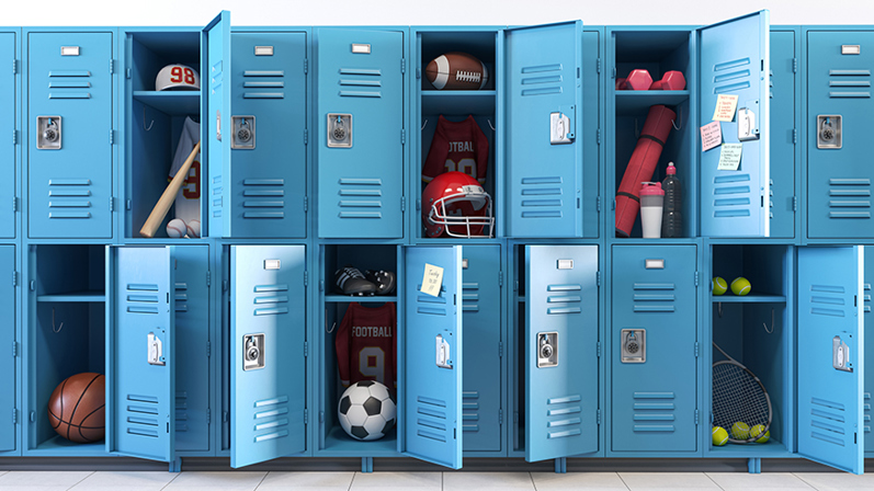 Open blue high school sports lockers containing football, baseball, basketball, soccer, tennis, and workout equipment.